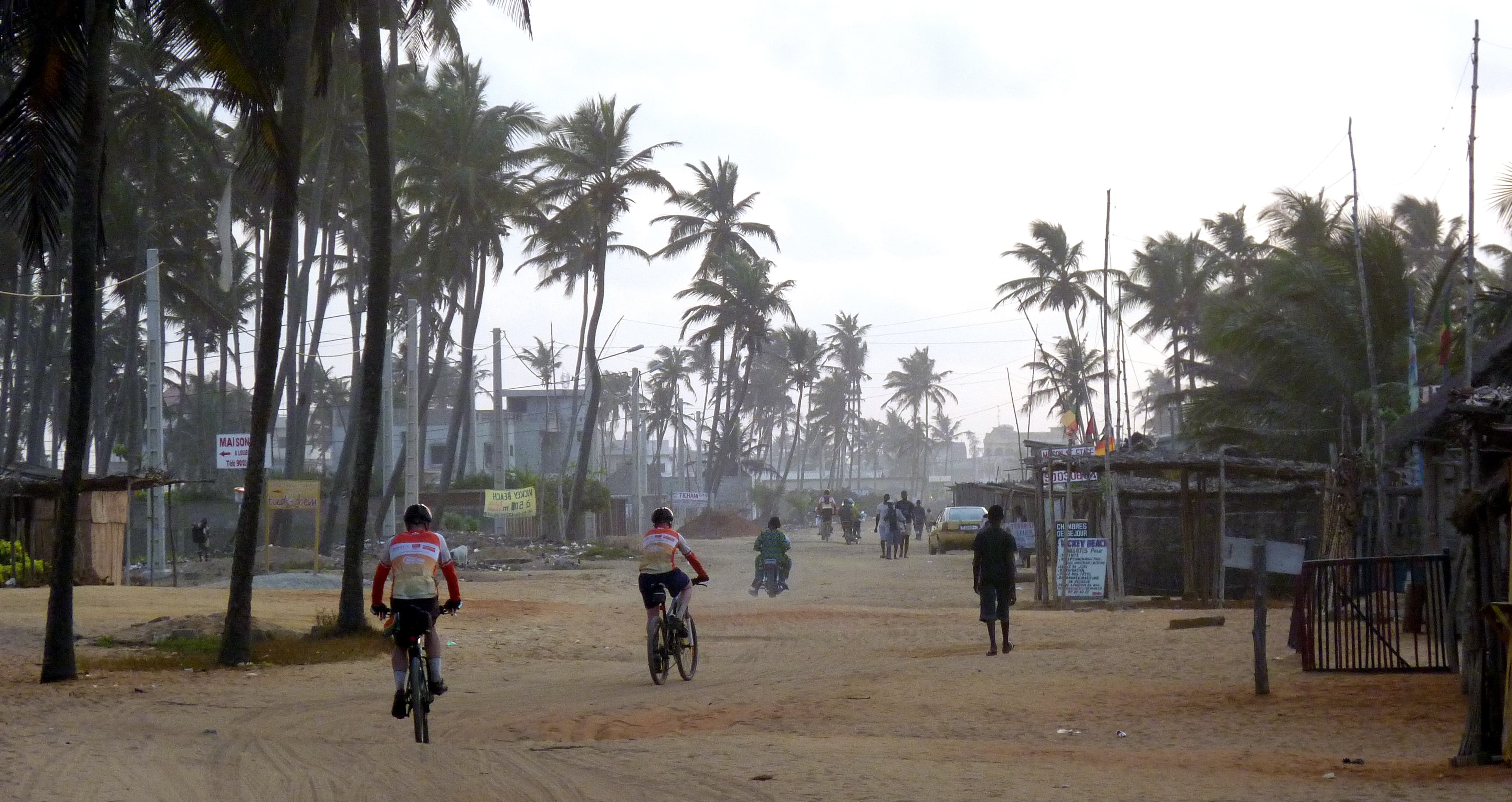 Cyclists on a dusty African road