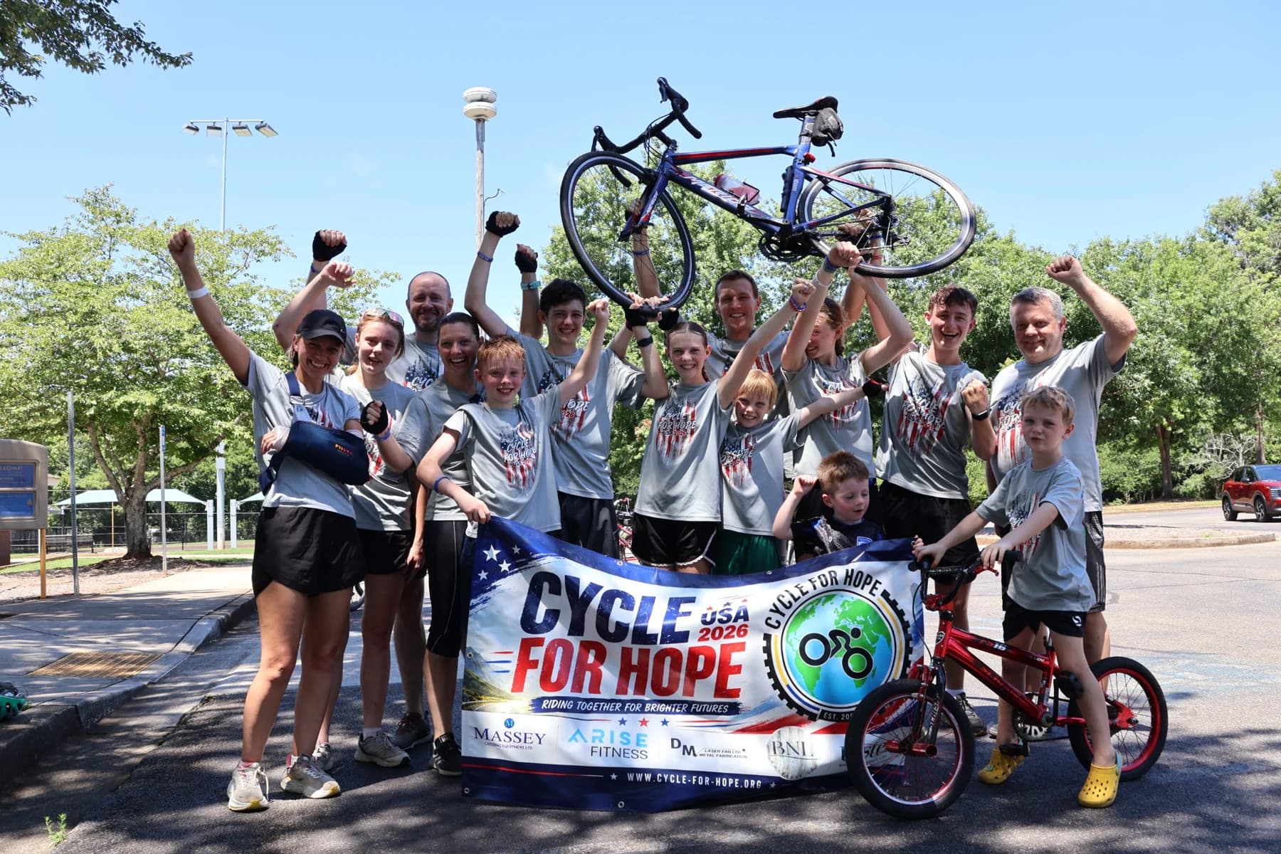 The Cycle for Hope USA team celebrating together at the finish