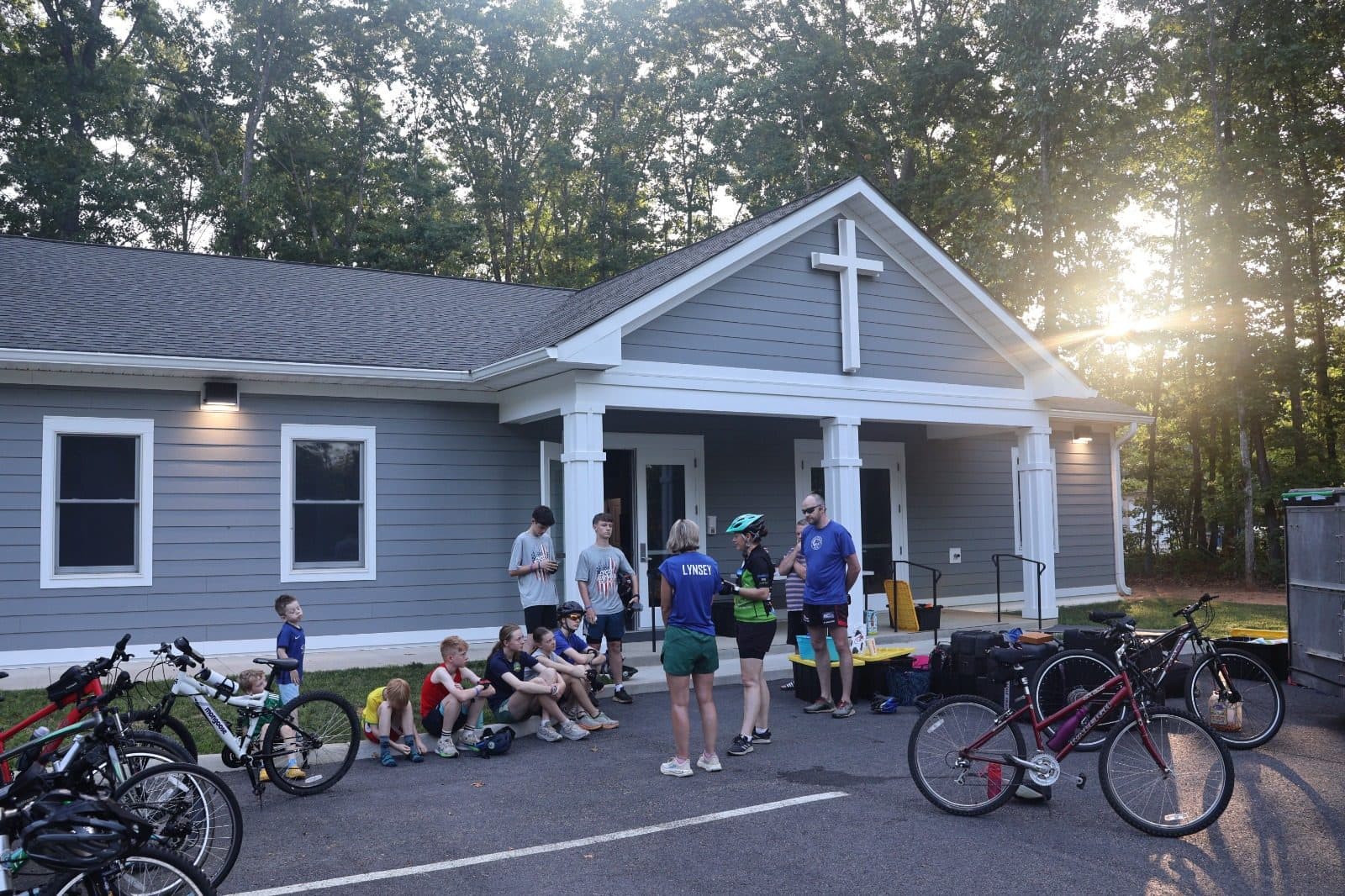Riders and bikes gathered outside a church that hosted the team overnight